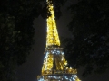 Street view of the Eiffel Tower at night