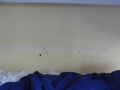 You can see the holes in the wall next to my bed